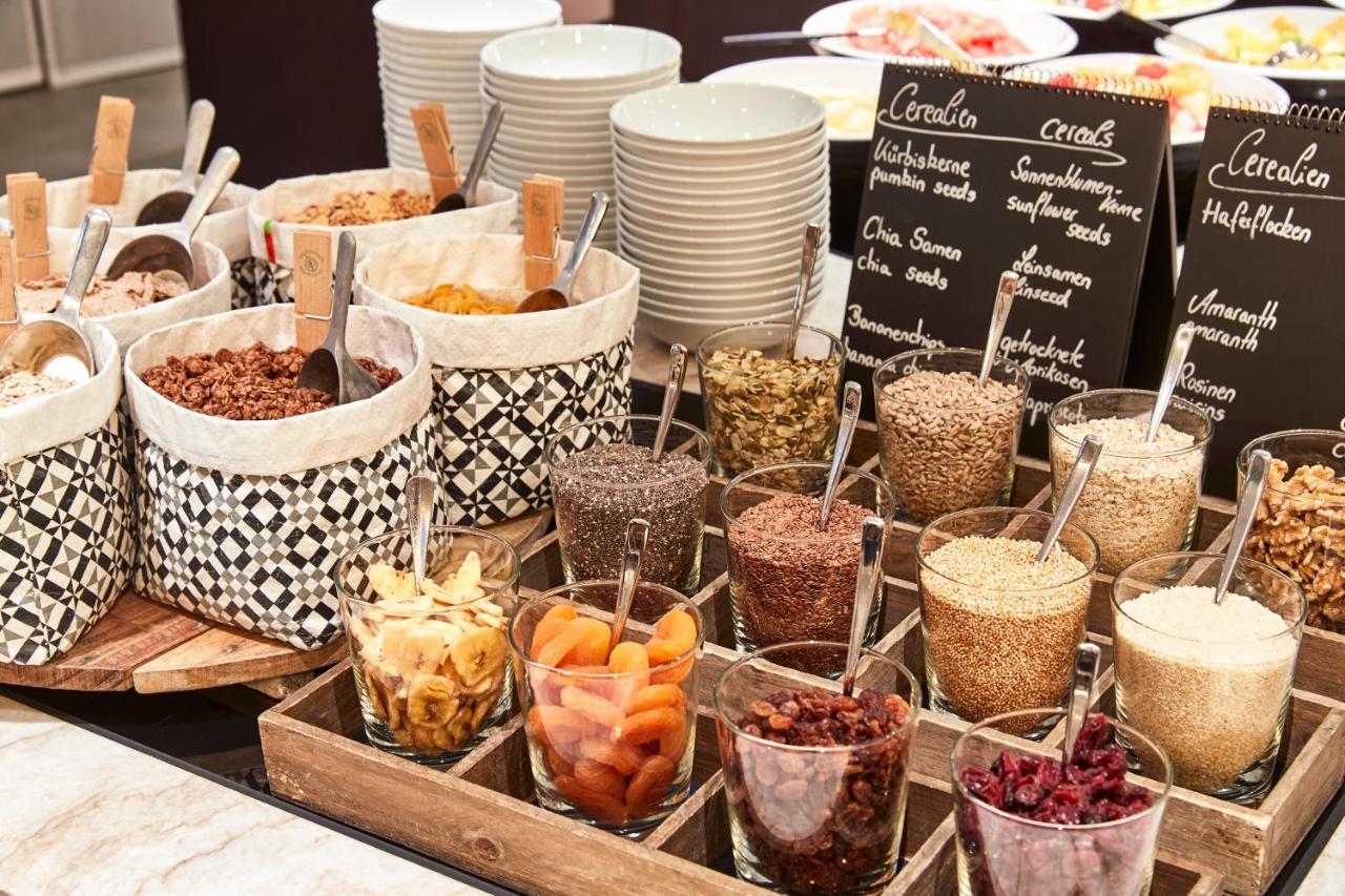 Steigenberger Hotel Hamburg Exterior photo A selection of cereals at a breakfast buffet